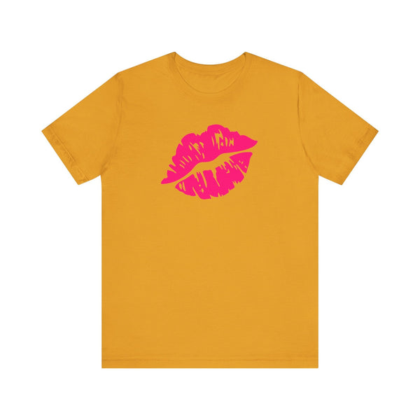 Neon pink lip print tee on orange backdrop, statement fashion piece.