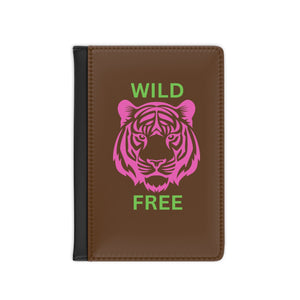 Colorful tiger passport cover with "Wild & Free" design, vibrant travel accessory.