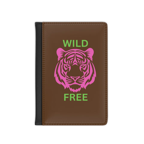Colorful tiger passport cover with "Wild & Free" design, vibrant travel accessory.