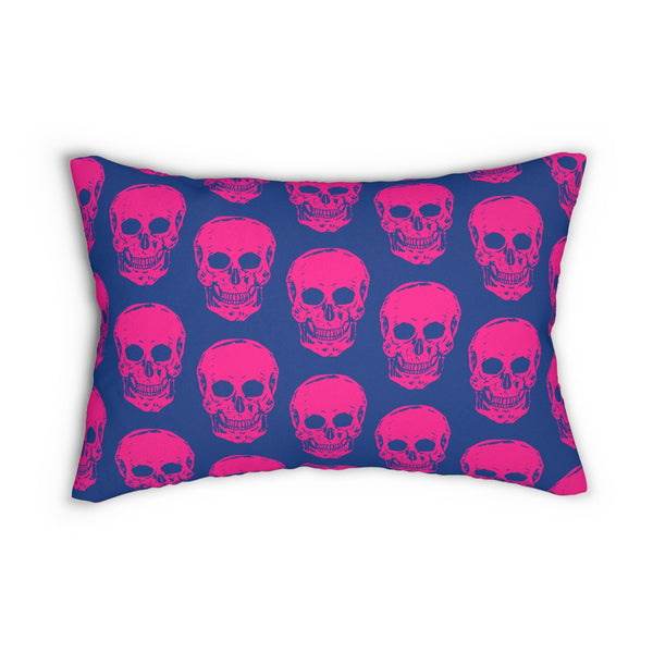 Vibrant neon pink skull print lumbar pillow on deep blue background.