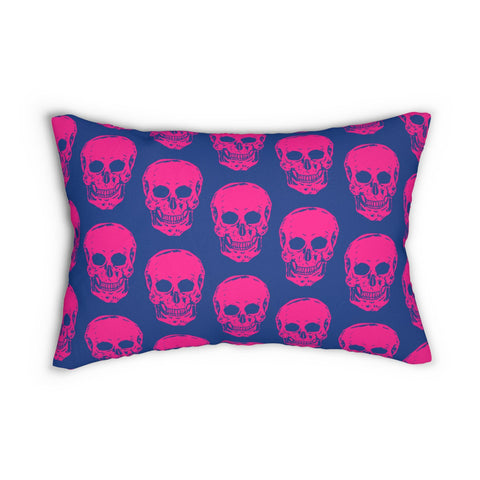 Vibrant neon pink skull print lumbar pillow on deep blue background.