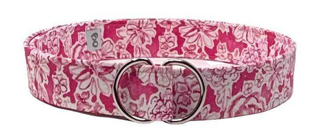 Bright pink floral D-ring belt with bold pink and white pattern.