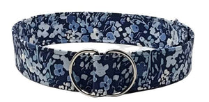 Navy floral wide D-ring belt with delicate blue and white flowers on high-quality fabric.